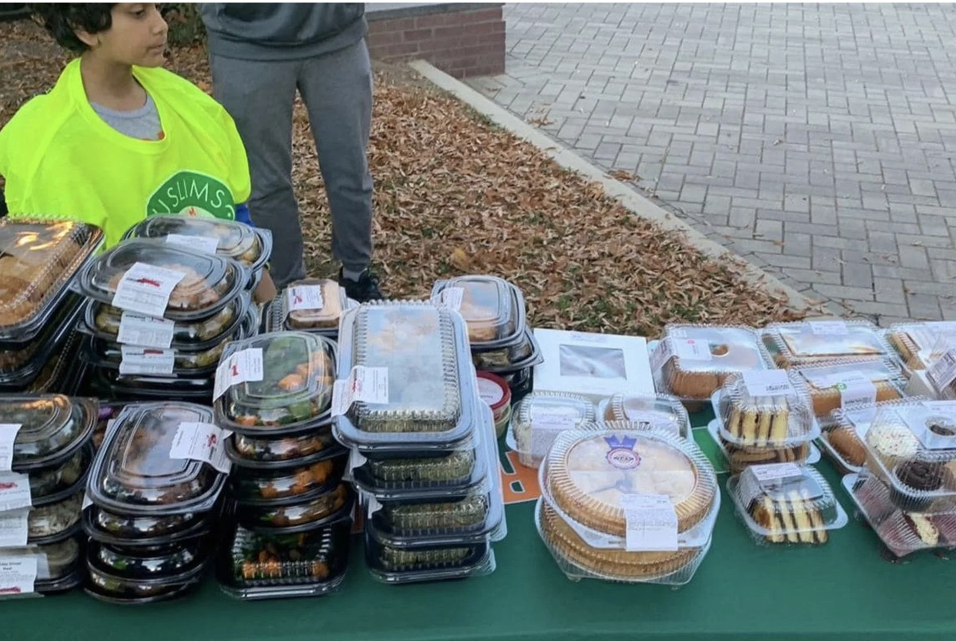 De Lune supporting a community food donation with ICNA Relief